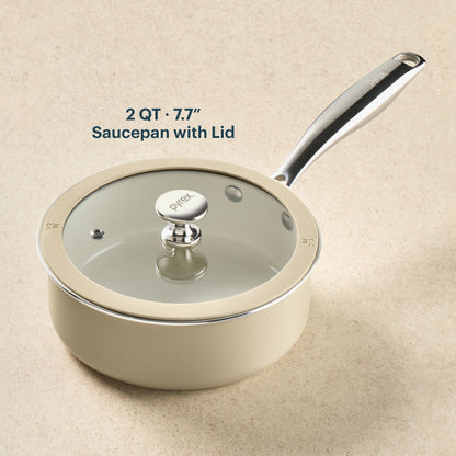 Beige saucepan with lid on a beige background